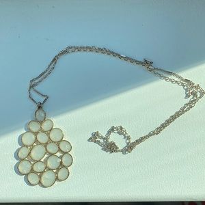 Anthropologie long necklace features a large cluster of white stones